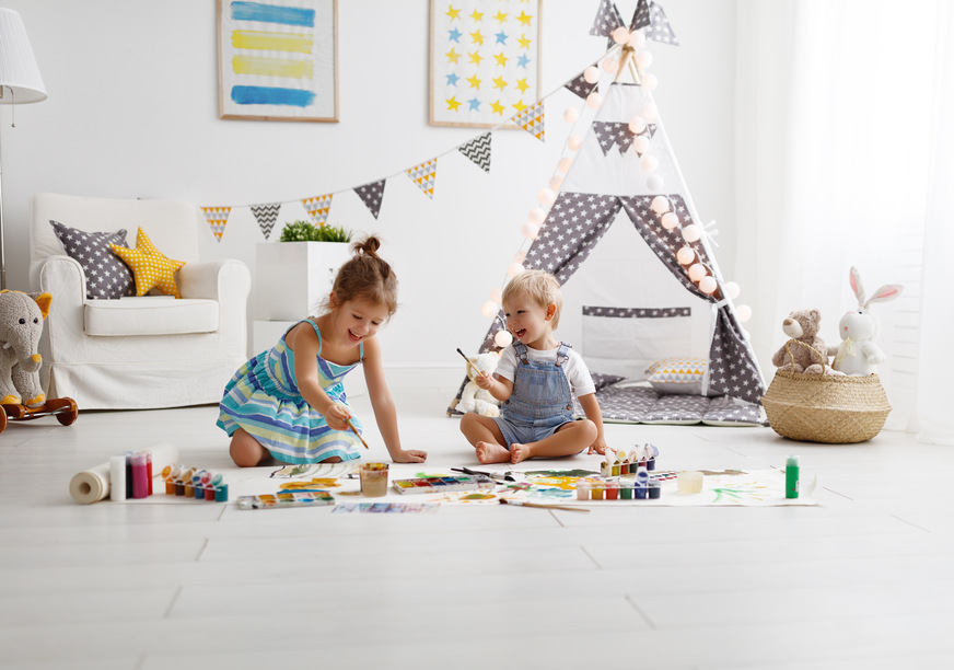 a happy funny children paint with paint