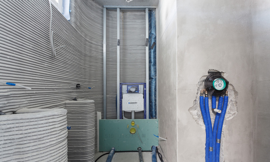 Bild 7 Die Integration von TGA/E-Gewerken in den 3D-Druckprozess vereinfacht Installationsarbeiten, spart Zeit und Kosten und erübrigt weitgehend auch nachträgliche Stemmarbeiten.