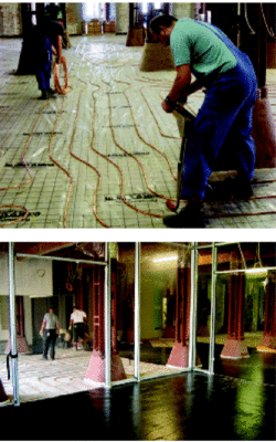 Flächenheizung mit Gussasphalt: Ausgleichsschicht, zwei Lagen verdichtete Mineralfaser­dämmung, Wollfilzrohpappe, Verlegefolie, cuprotherm.blank-Heizungsrohre und Gussasphalt mit 240 °C in zwei Schichten aufgetragen (im Bild ist nur die erste Schicht eingebracht).