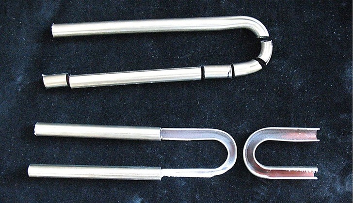 Hannemann: Aufgeschnittene Mäanderbögen aus Röhrenkollektoren ohne Ablagerungen und ohne Korrosions­erscheinungen.