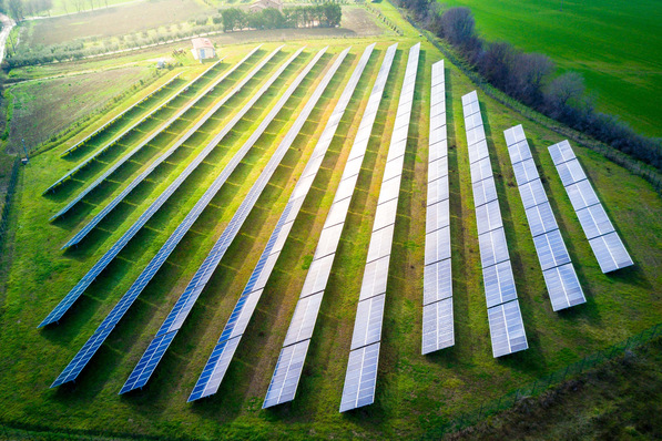 aerial view of solar panels on a sunny day. power farm producing clean energy