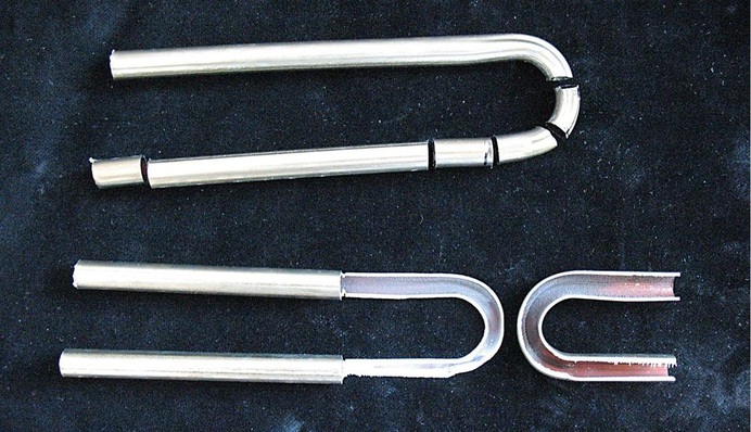 Hannemann: Aufgeschnittene Mäanderbögen aus Röhrenkollektoren ohne Ablagerungen und ohne Korrosions­erscheinungen.